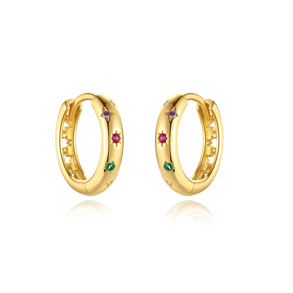 isolated pair of 925 silver huggies with multicolor zirconia stars