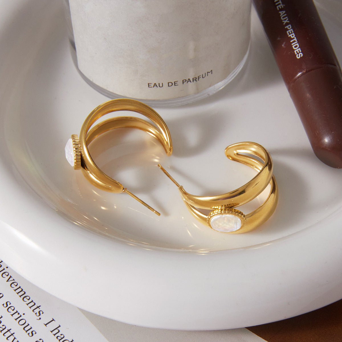 Open backs and parallel bands of double hoop earrings