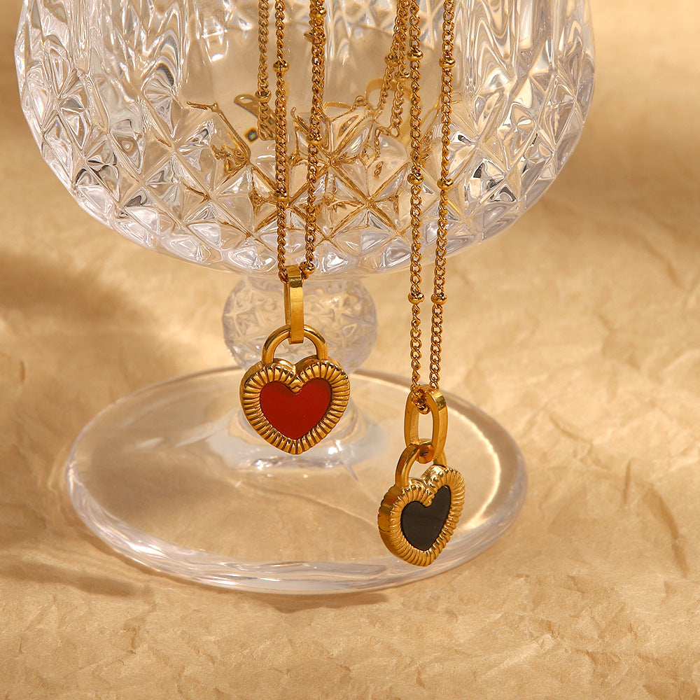 Ridged heart pendant necklaces displayed at different heights