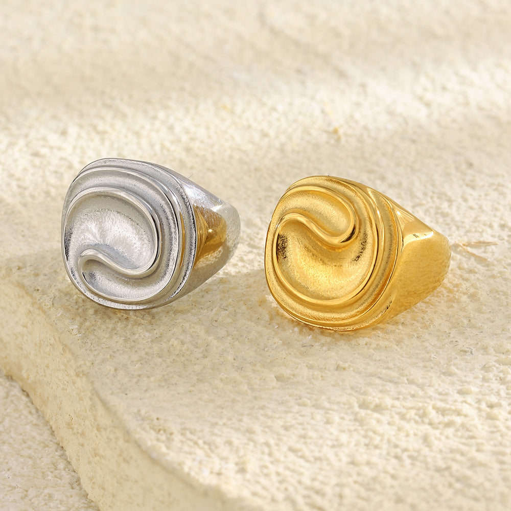 gold plated and silver finish sculptural ripple signet rings