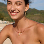Fish charm collar necklace worn outdoors