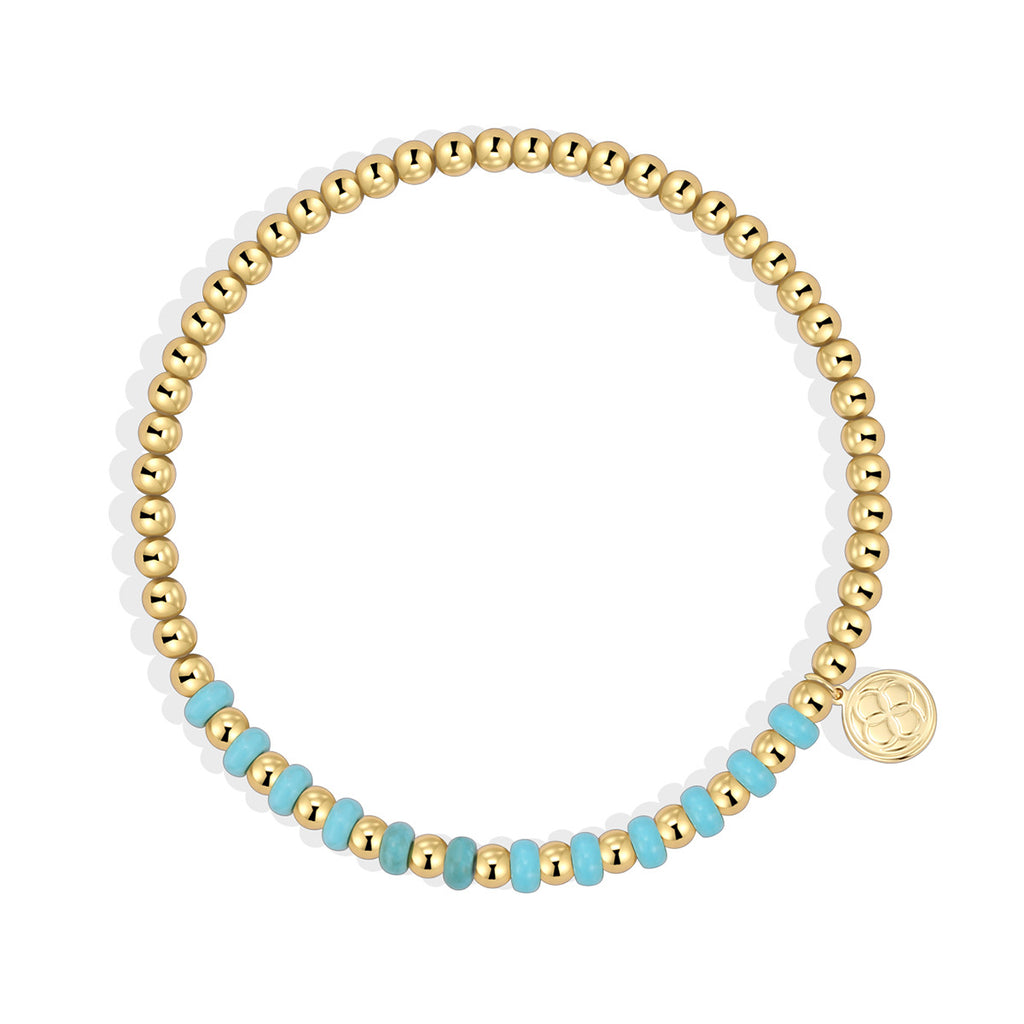 isolated gold plated bead bracelet with centered blue accent section