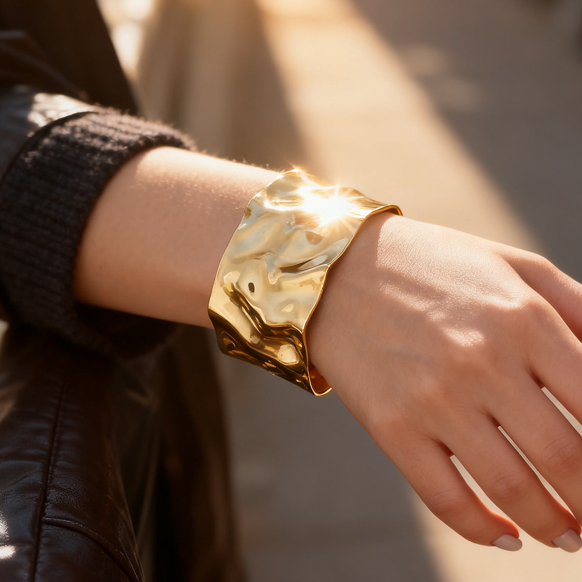 bold hammered gold plated cuff bracelet worn on the wrist