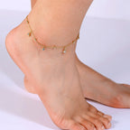 cubic zirconia drop anklet with polished beads worn at the ankle