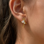 Curved zirconia stud earring worn on the lobe