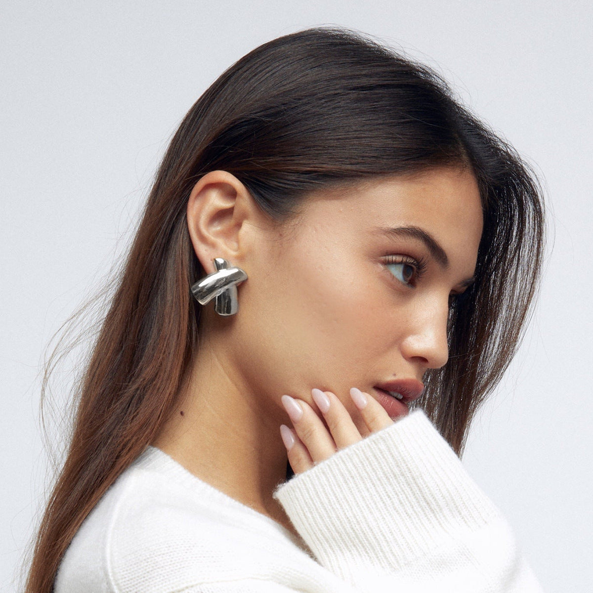Sculptural X Stainless Steel Stud Earrings in Two Finishes close-up product view