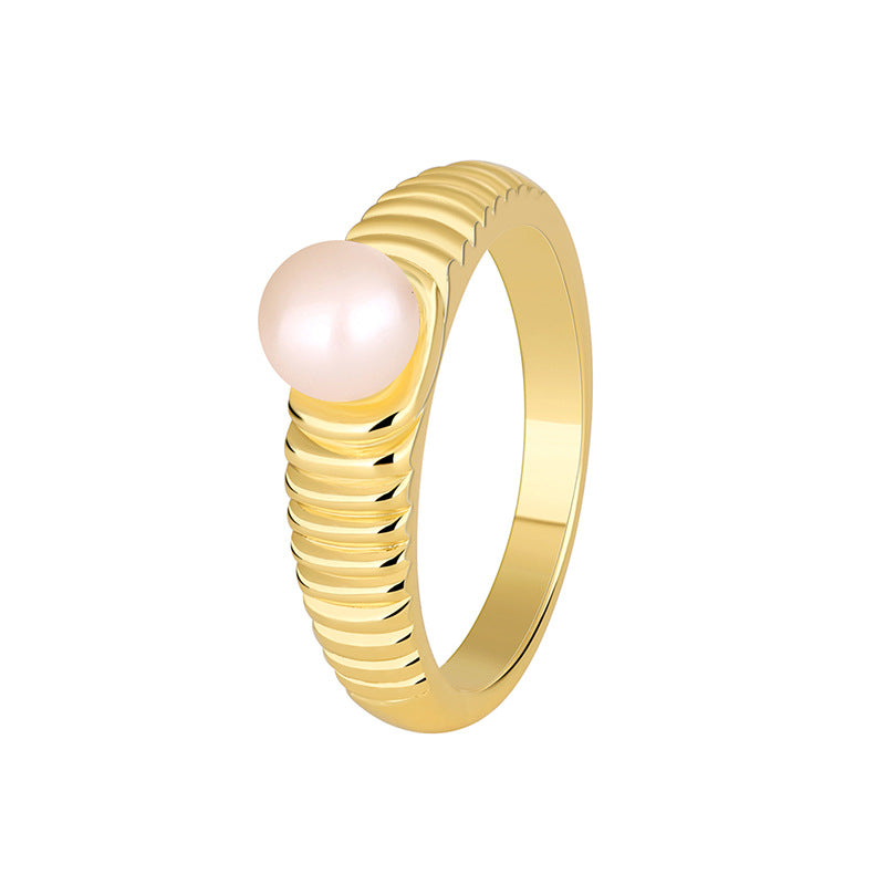 isolated gold plated brass ribbed shell pearl ring