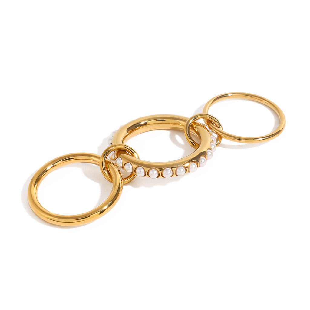 Gold-tone triple ring extended to show connecting loops