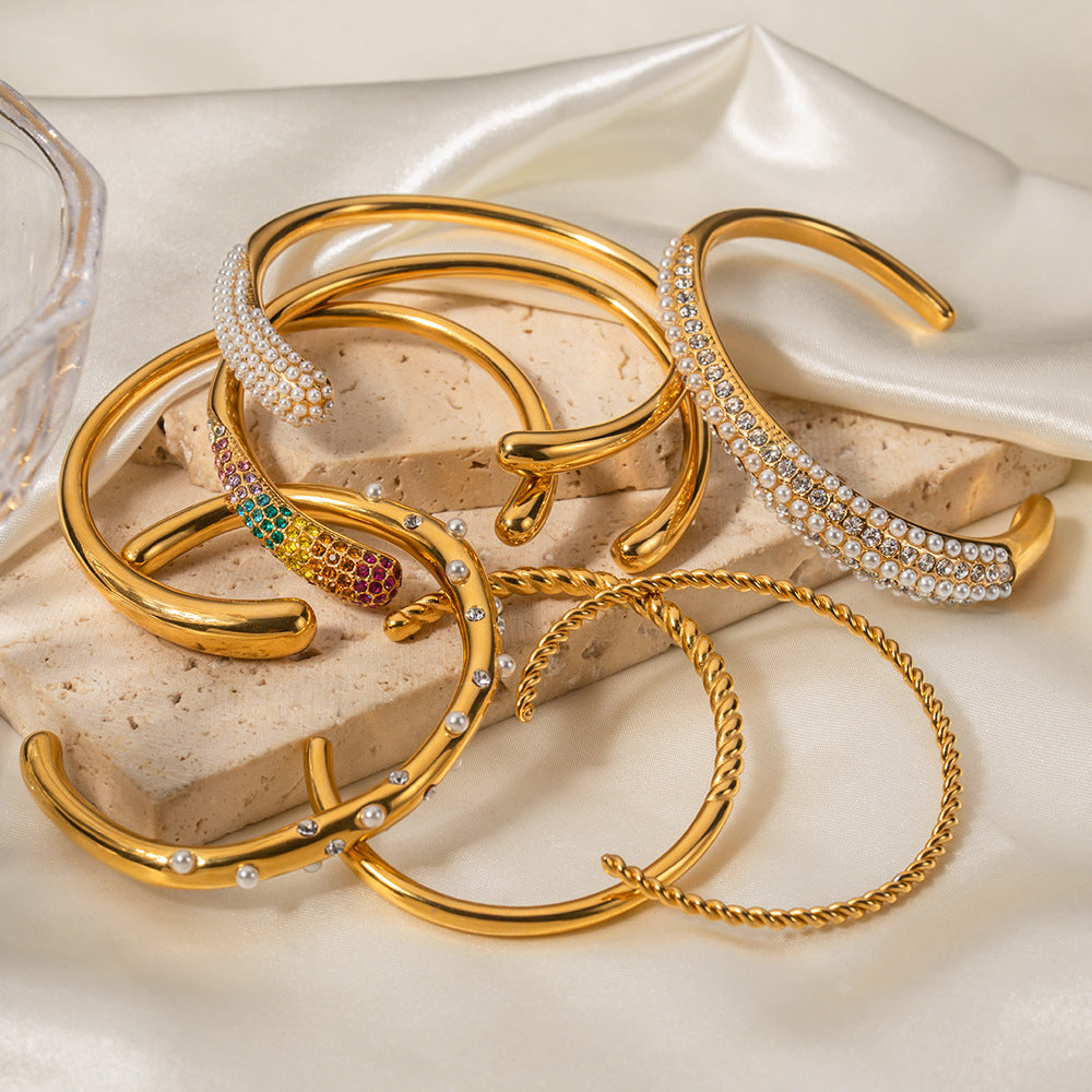 Open stainless steel cuff bracelet collection display