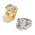 front view of broad stainless steel signet rings with clear stones