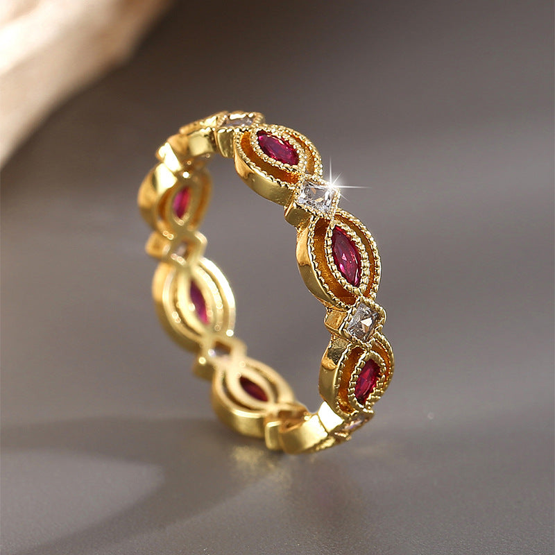 angled marquise stone band with red and clear accents