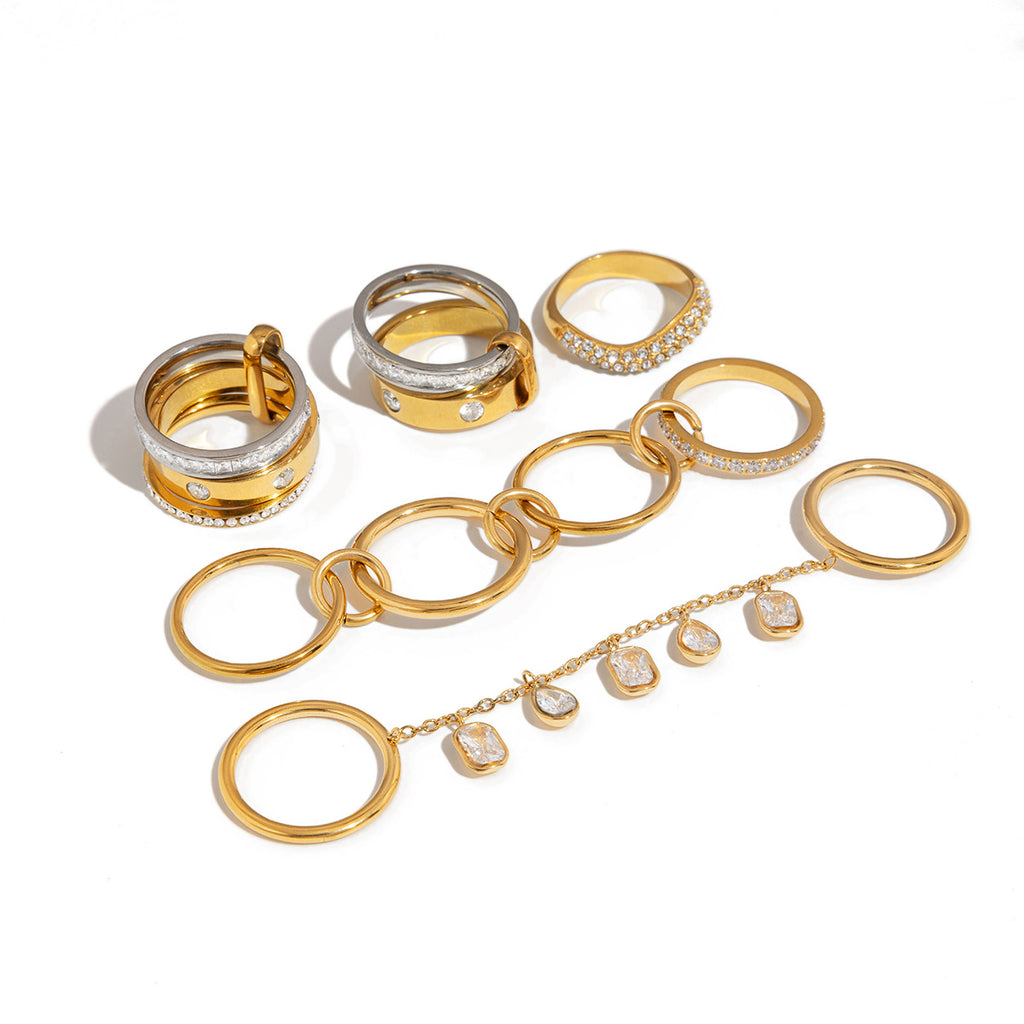 Linked and layered ring designs arranged on white