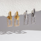 Two finishes of rectangular frame earrings hanging together