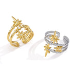 Gold and two-tone open rings showing layered star design