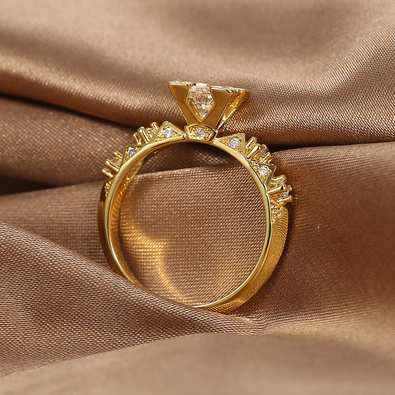 side view of triangular fan motifs and raised zirconia setting