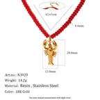Red resin bead lobster necklace with material and length diagram