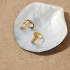 Mermaid tail hoops resting on a shell