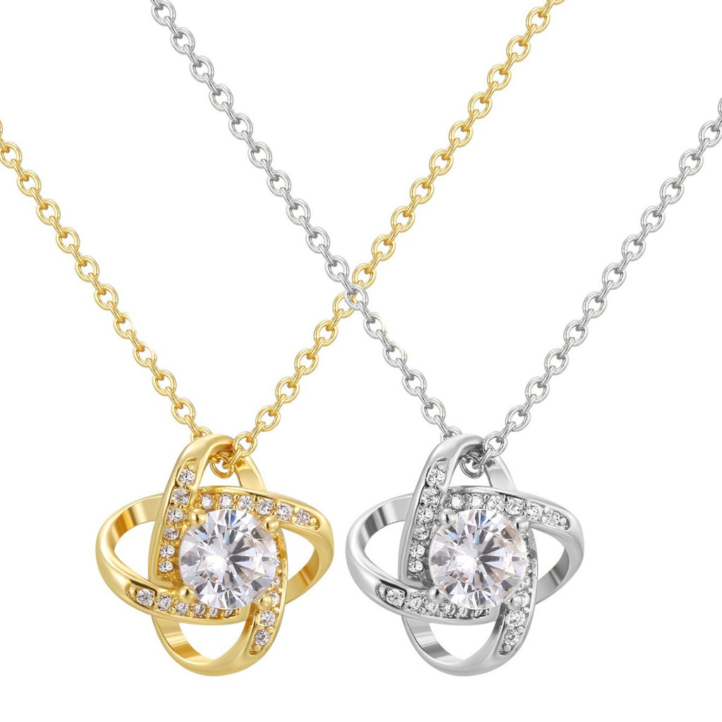 front view of gold and silver orbit clear stone pendant necklaces