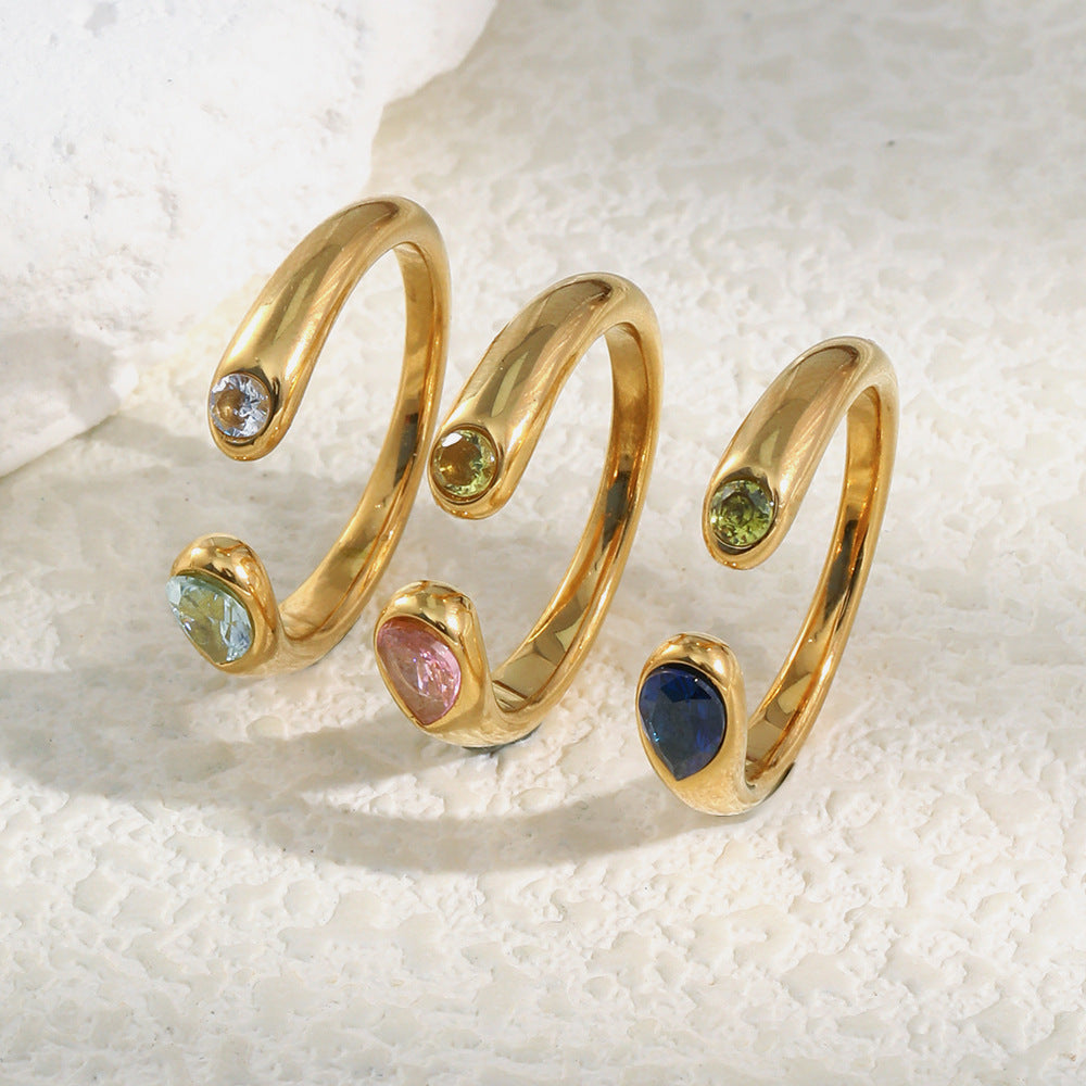 assorted gold plated snake open rings with paired colored stones