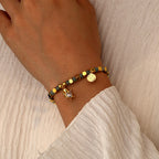 model wearing a sea turtle bracelet with heart-shaped clear stone