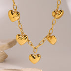 Gold-Tone Puffed Heart Stainless Steel Charm Necklace close-up product view