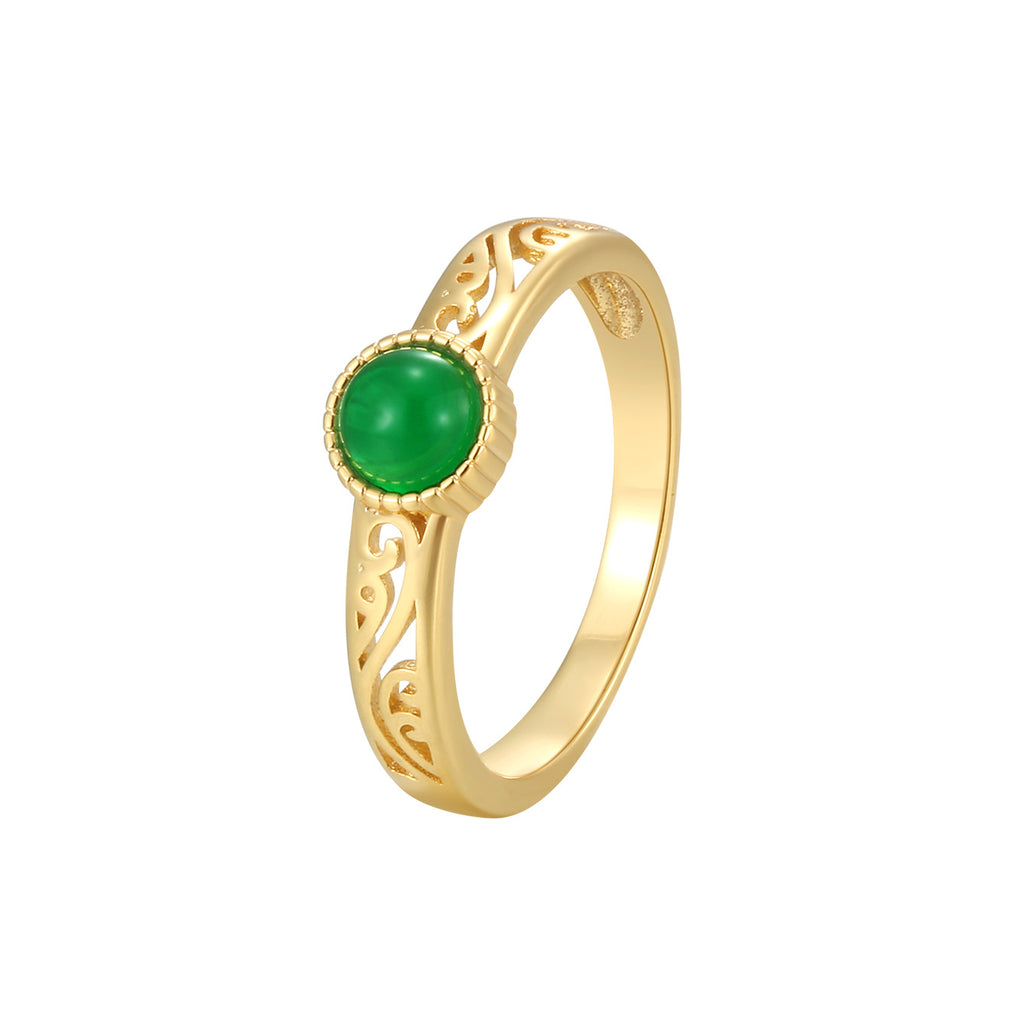 isolated gold plated green agate filigree ring on white