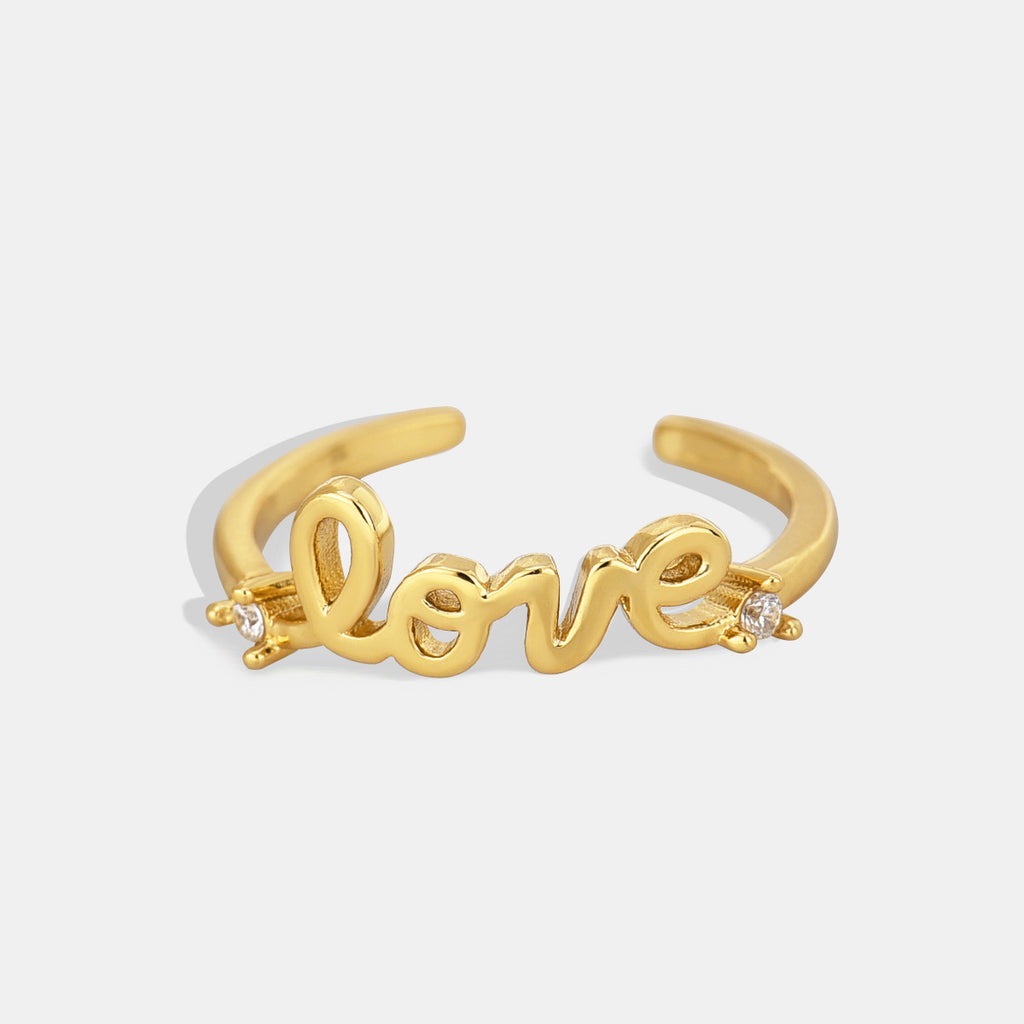 gold plated brass LOVE script open ring with clear stone accents