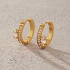 Pair of stone-lined hoops on a neutral surface