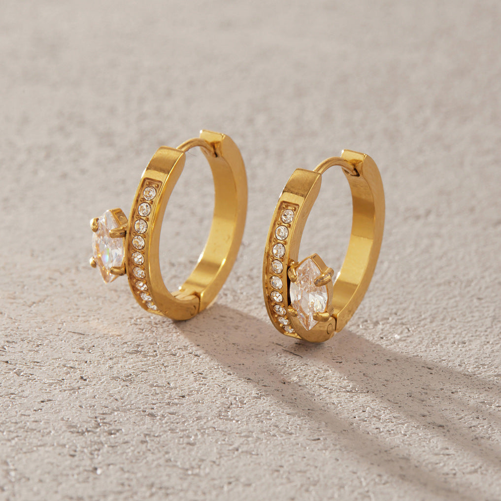 Pair of stone-lined hoops on a neutral surface