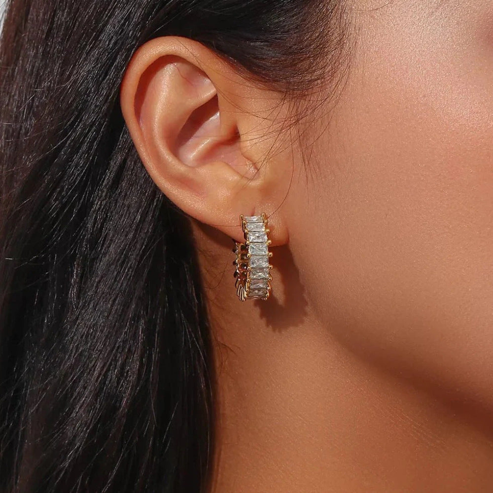 Rectangular zirconia open hoop worn on an ear