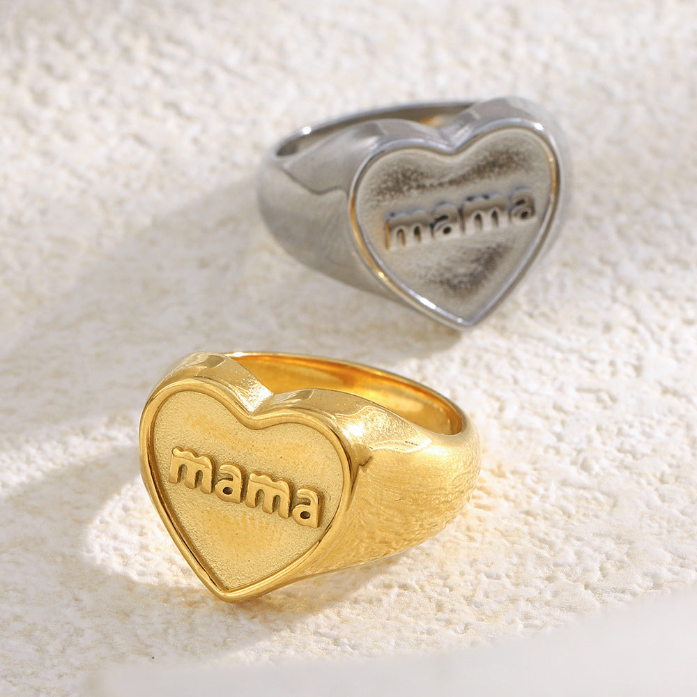 silver and gold heart signet rings with raised mama lettering