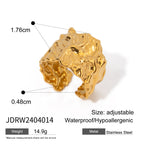 Broad irregularly textured gold-tone open band