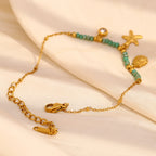 Gold Plated Stainless Steel Green Bead Starfish and Shell Bracelet — starfish charm close-up