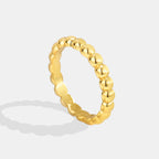 gold plated brass ring with a full sculpted bead band
