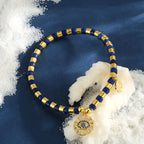 deep blue lapis lazuli evil eye bracelet on a blue display