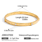 Hammered bangle with spaced clear accents