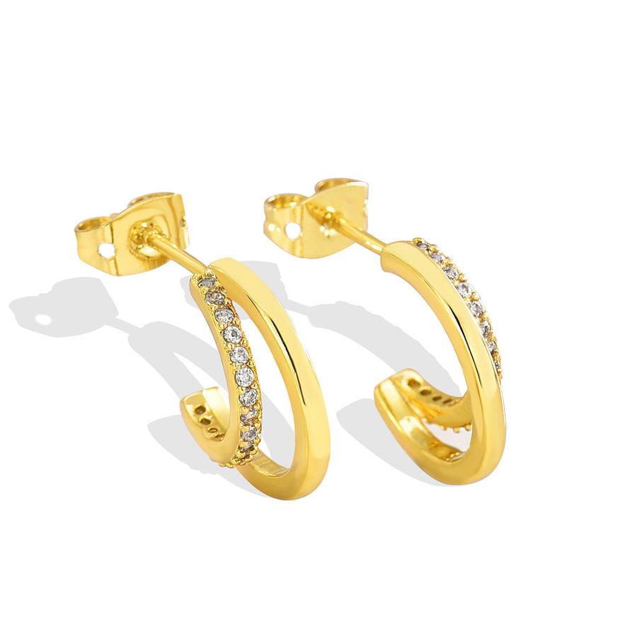 angled pair of gold plated brass pavé-style hoop earrings