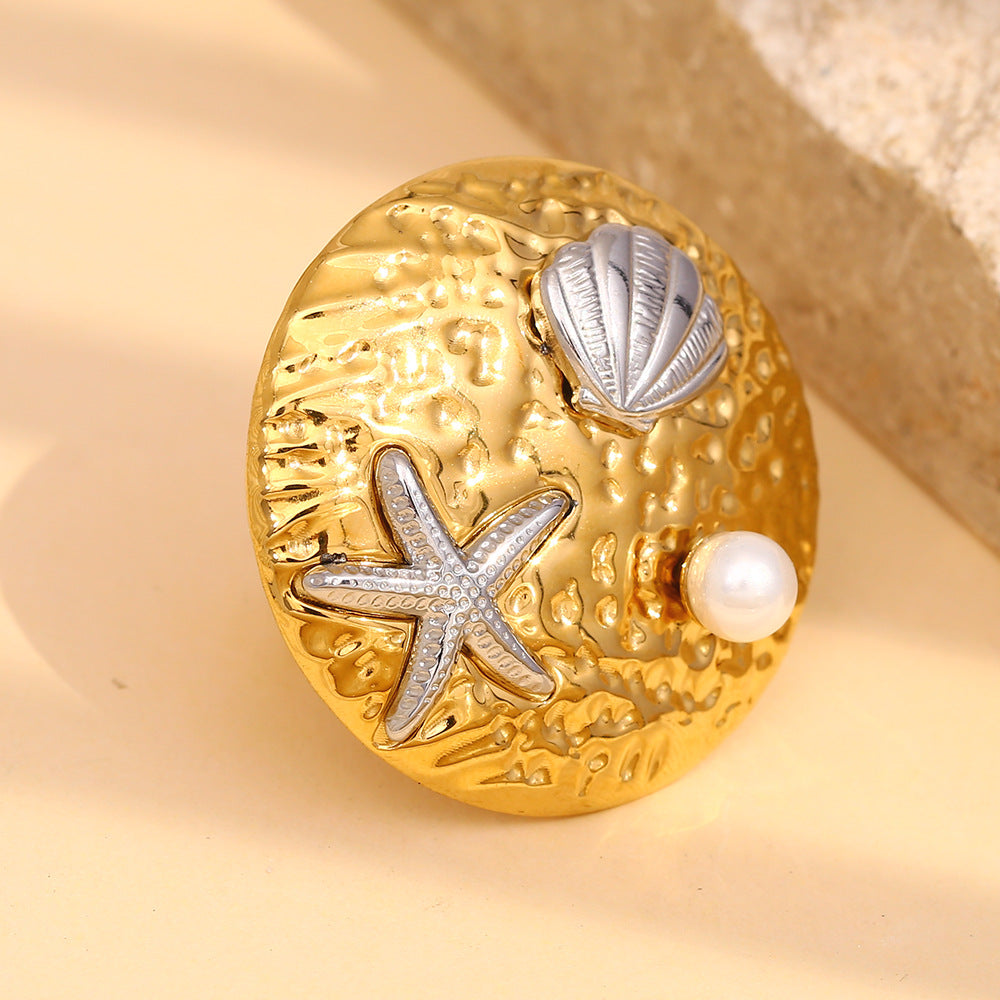 hammered round stainless steel ring with starfish and shell motifs