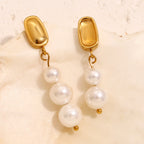 front and back view of mismatched pearl drop earrings