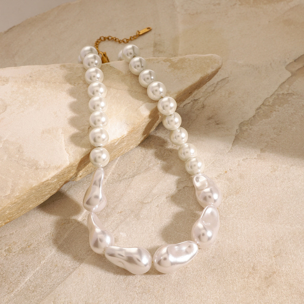 Mixed-shape white bead necklace with gold-colored fastening