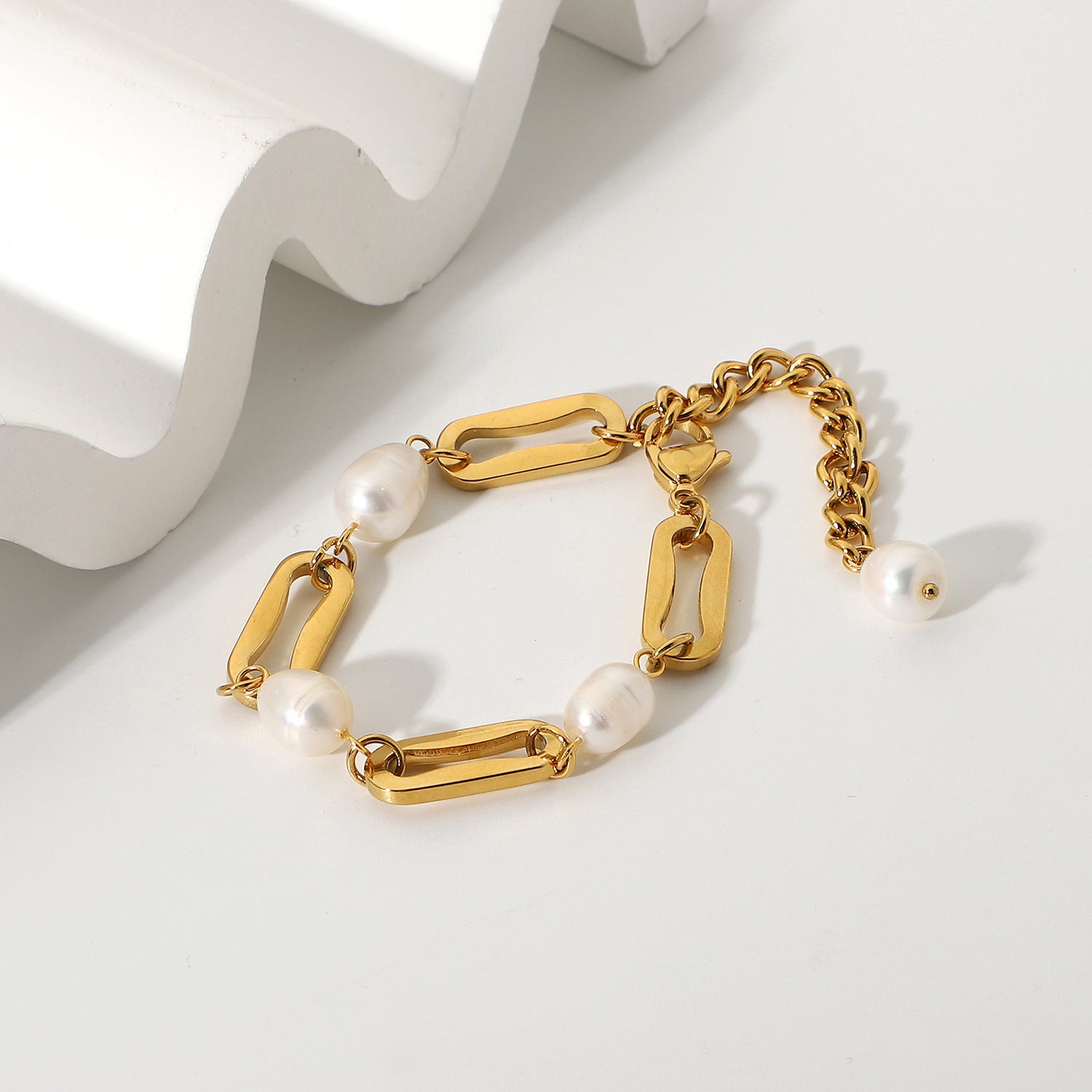 styled view of gold plated pearl link bracelet with extender