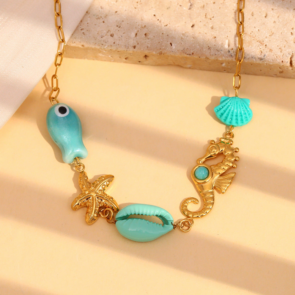 Gold plated stainless steel ocean charm station necklace front view