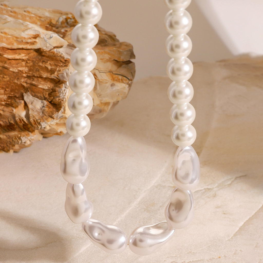 Close-up of the change from round to irregular white beads