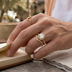Halo ring styled with a separate slim stone band