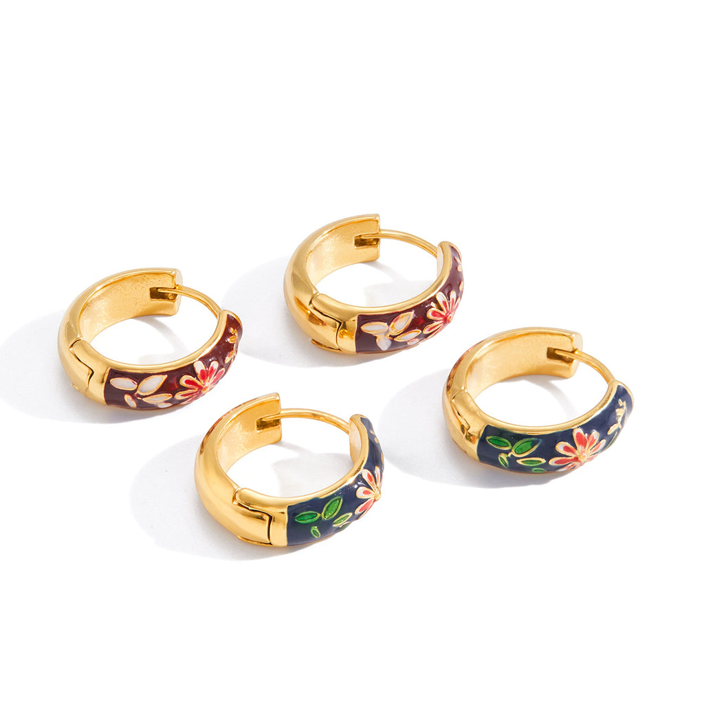 Gold tone hinged hoops with colored flower and leaf panels