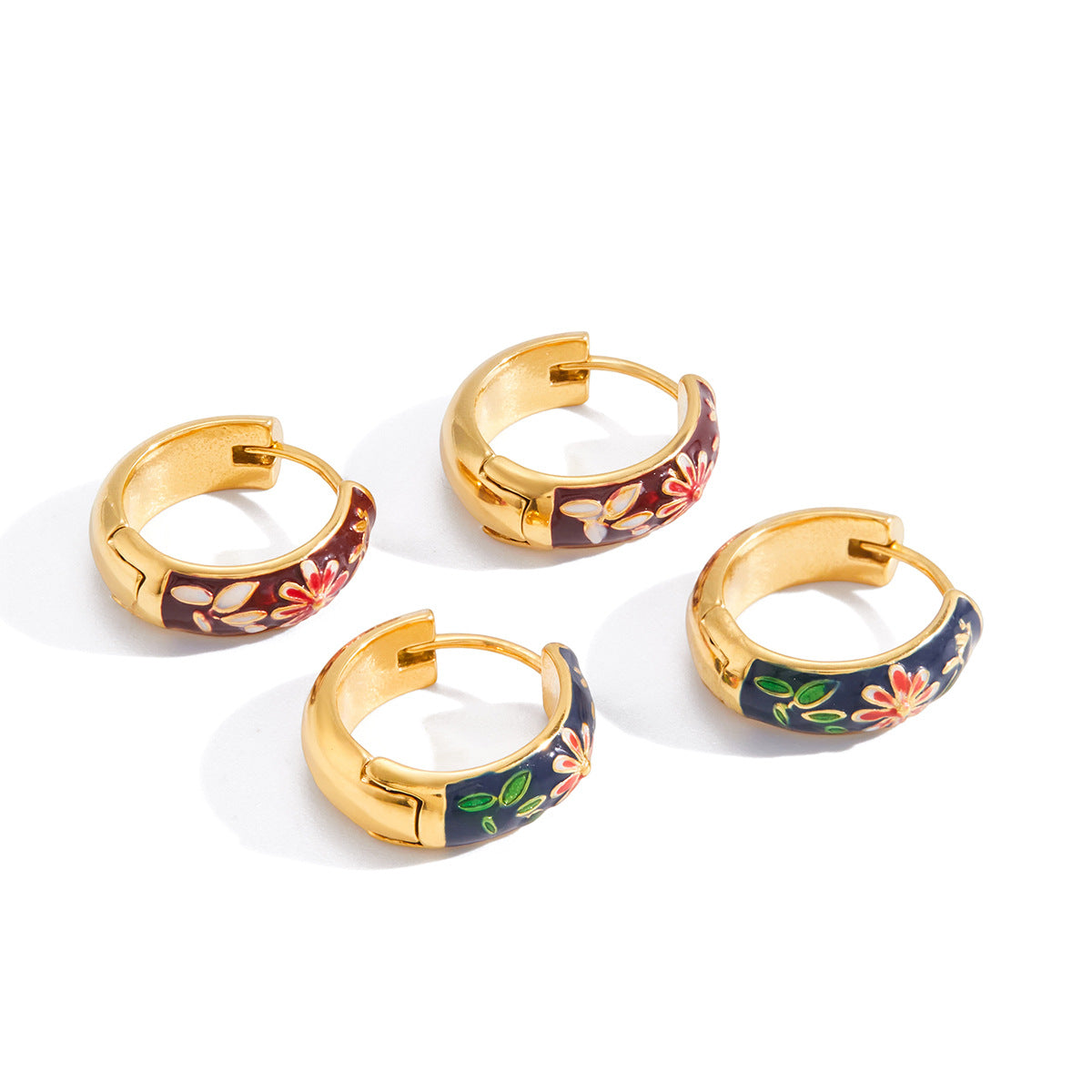 Gold tone hinged hoops with colored flower and leaf panels