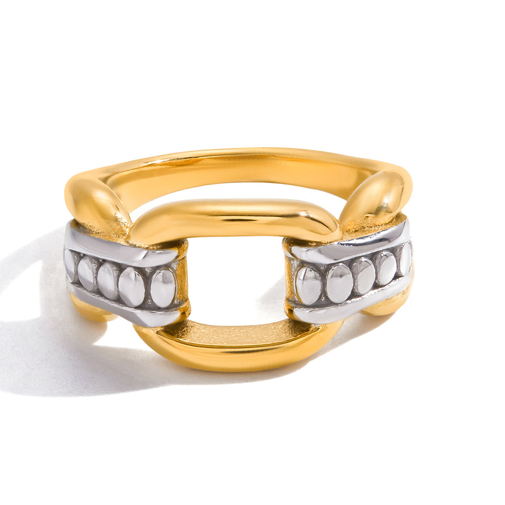 Broad link ring with pale oval accents in its silver-tone sections
