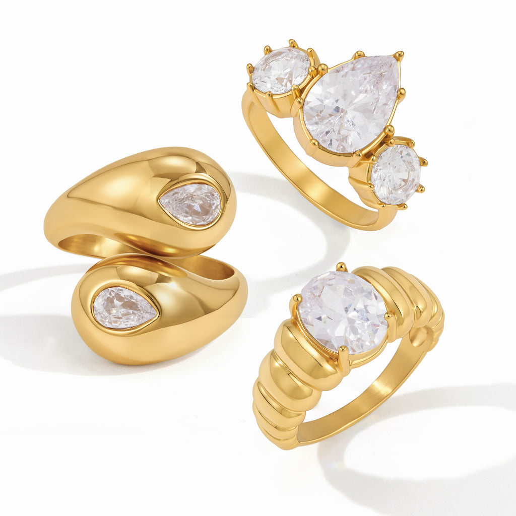Bypass solitaire and three-stone rings on white