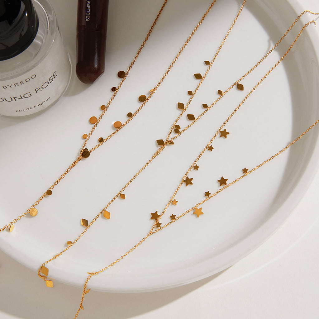 Three Y-necklaces with discs geometric tabs and stars