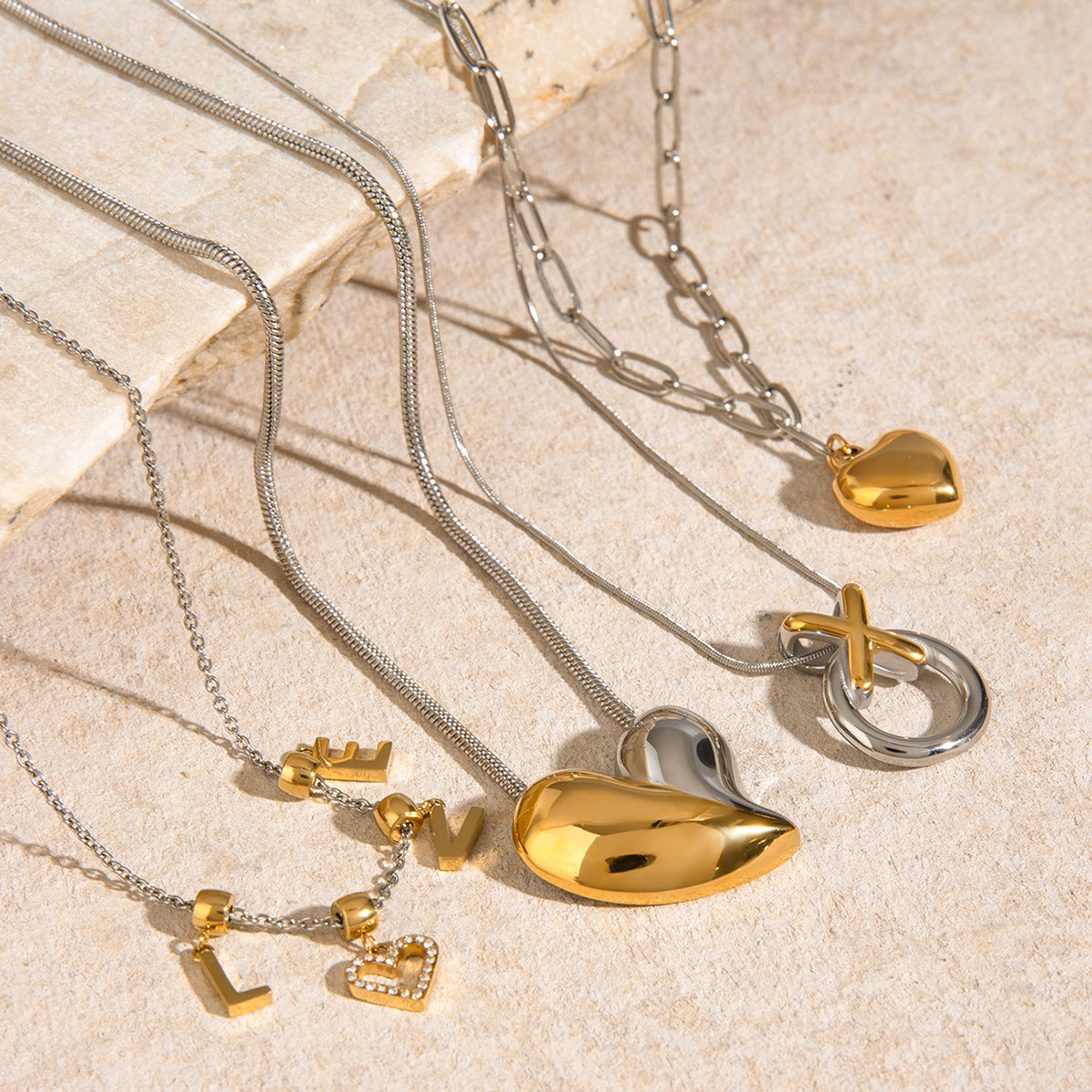 Mixed-Finish Stainless Steel Heart Necklace Collection close-up product view